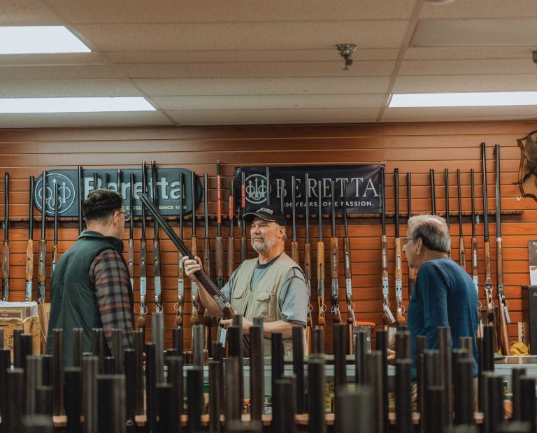 A hunter buying a used shotgun