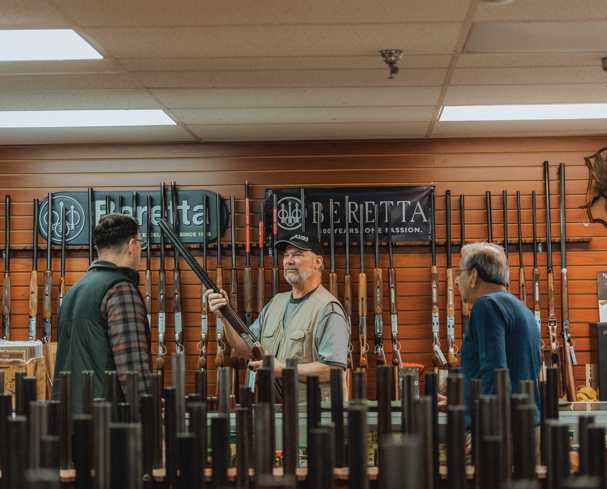 A hunter buying a used shotgun