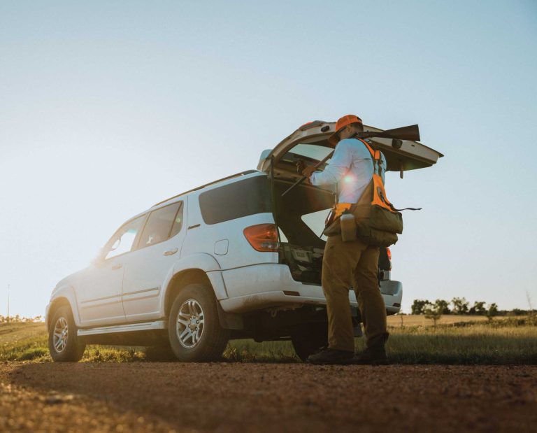 A sharptail grouse hunter wearing Danner Pronghorn boots