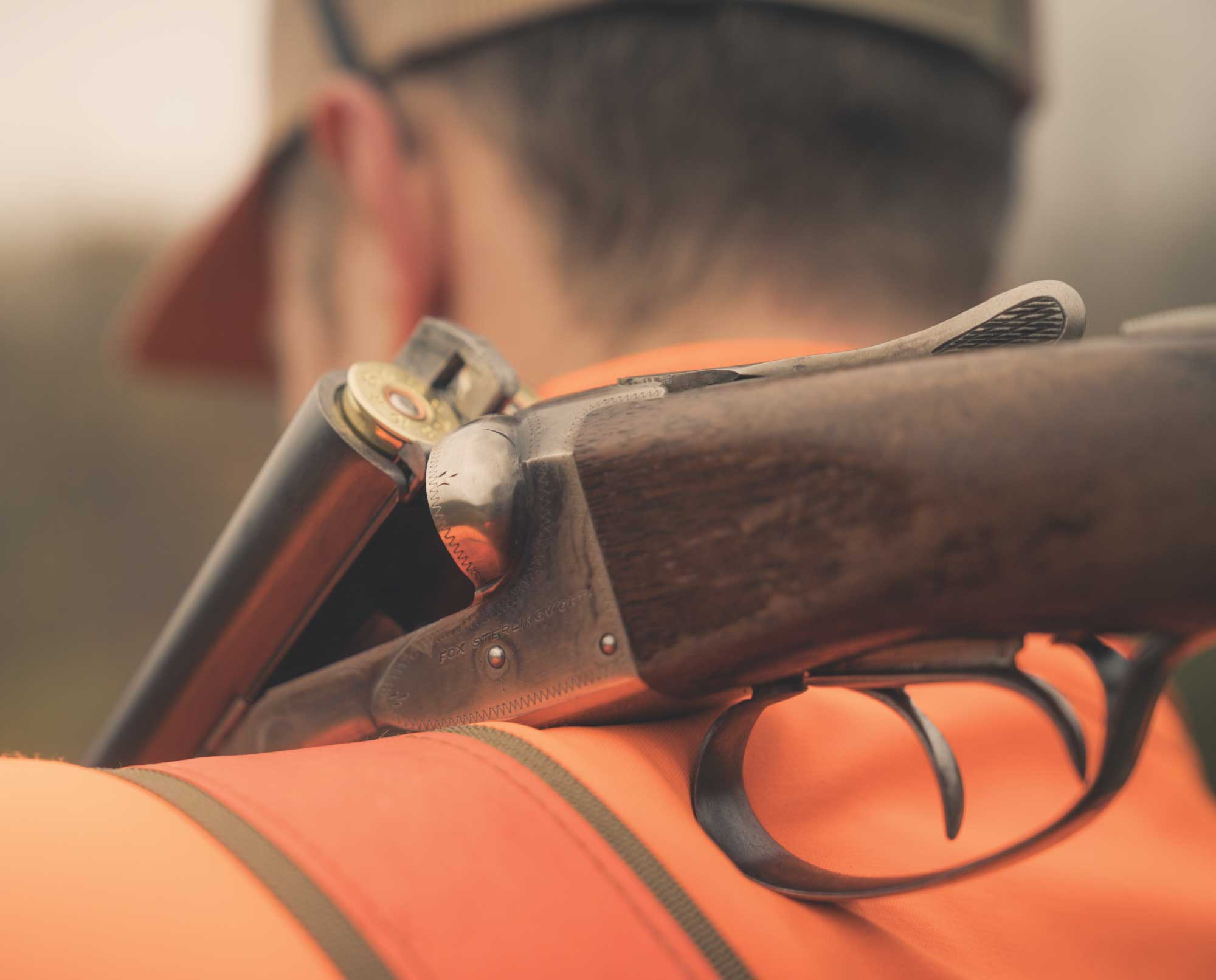 A bird hunter carries a Fox Sterlingworth