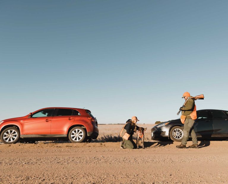 Bird hunters gearing up outside their cars