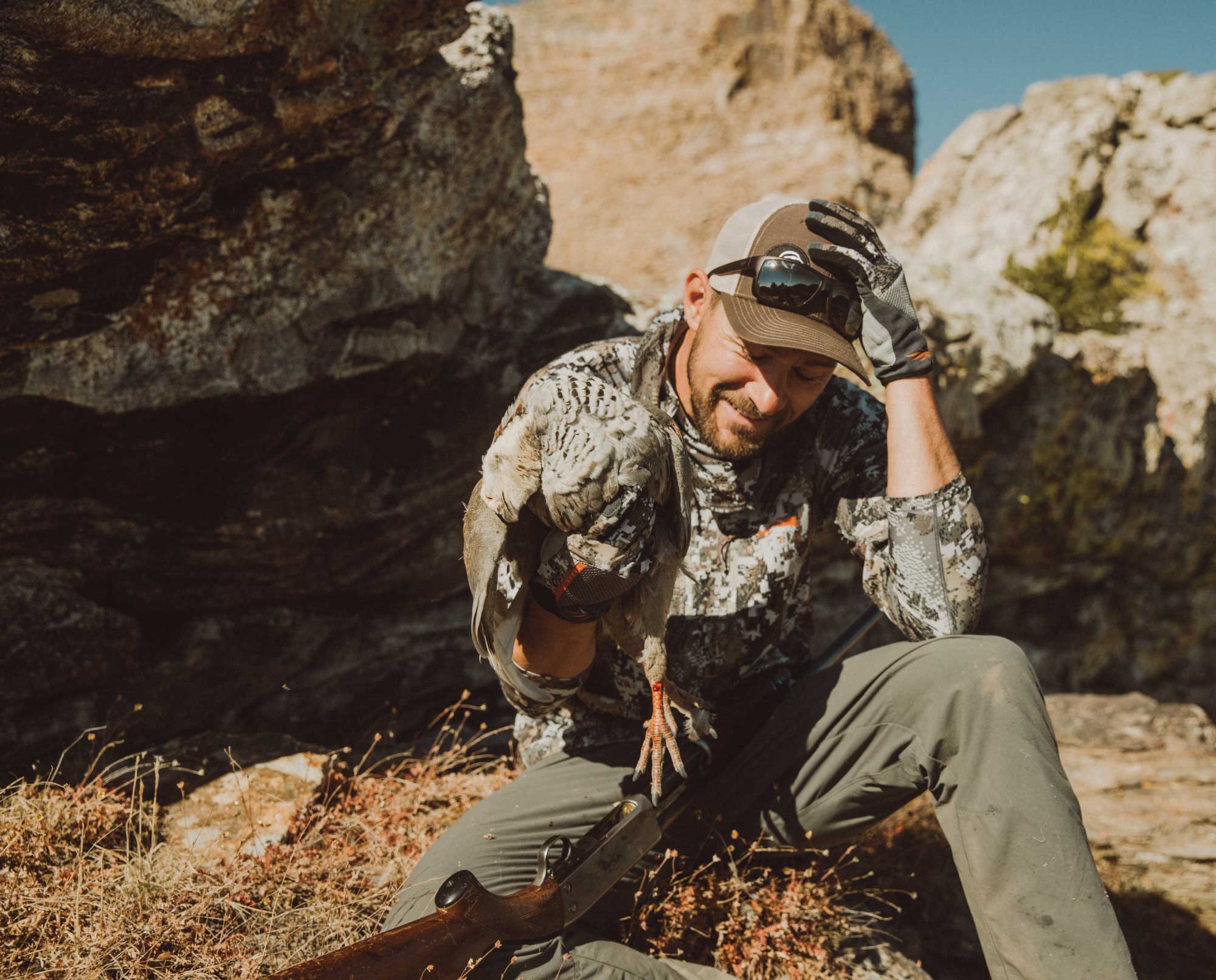 A bird hunter with a Himalayan Snowcock in Nevada.
