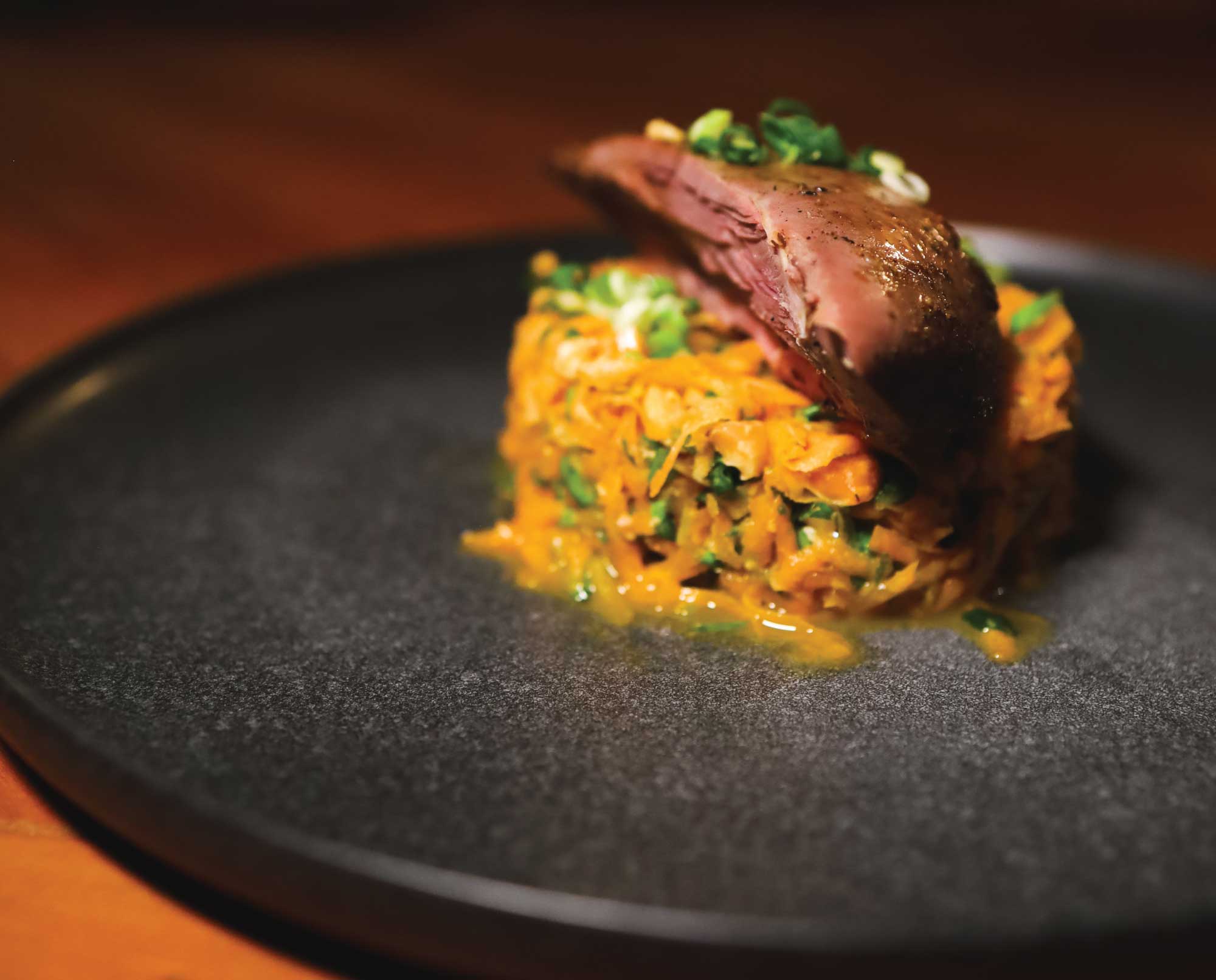 Roasted chukar plated with rice