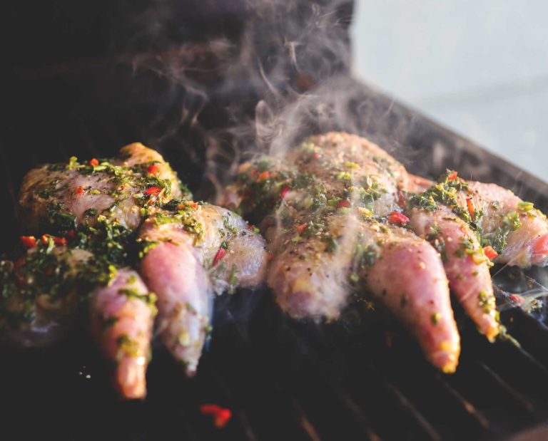 Two chukar on a grill