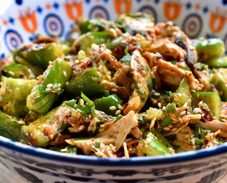 Shredded grouse meat and smacked cucumbers are tossed with an Asian sesame dressing and served in a colorful bowl