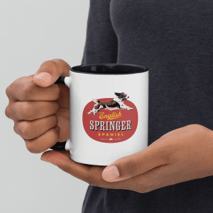 A man holding an English Springer Spaniel mug.