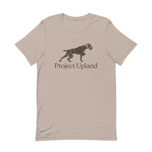 A German Wirehaired Pointer on an elegant point on a tan t-shirt