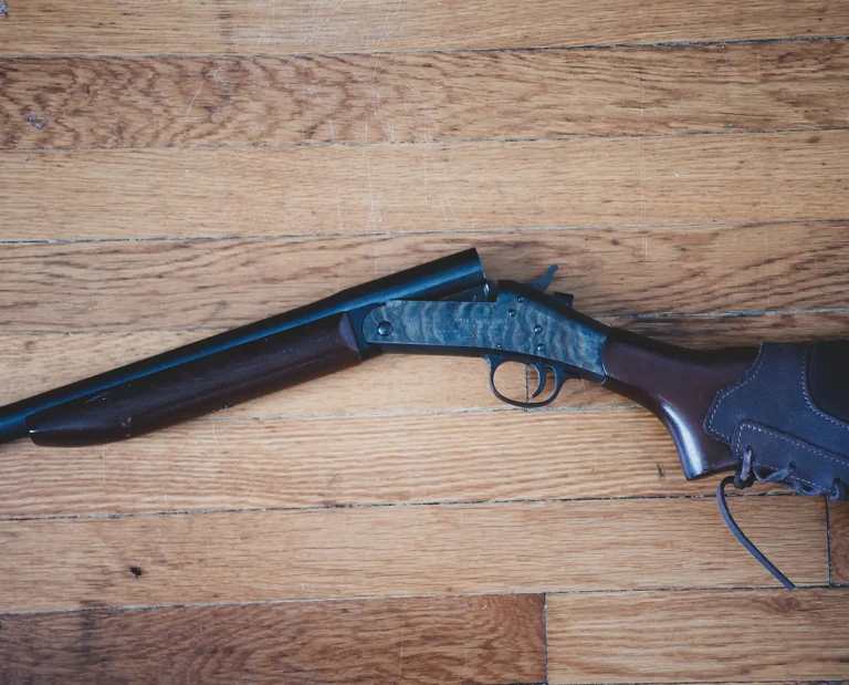 An H&R Topper 58 rests on the floor.