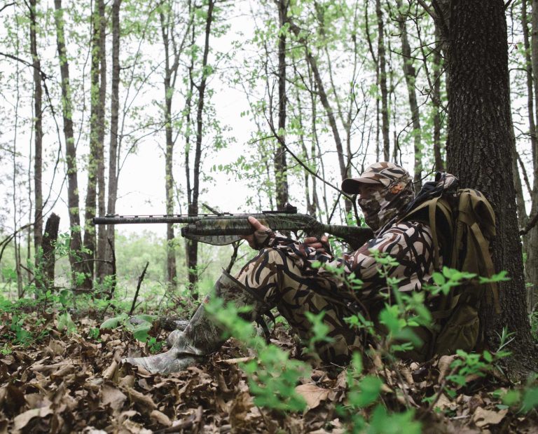 A turkey hunter about to take a shot with a gun that has been patterned.