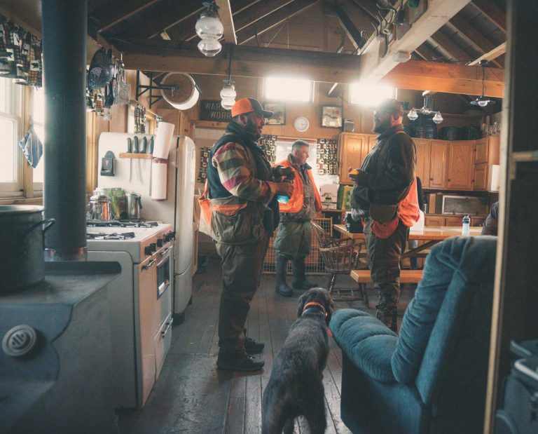 bird hunters inside grouse camp at warden worry
