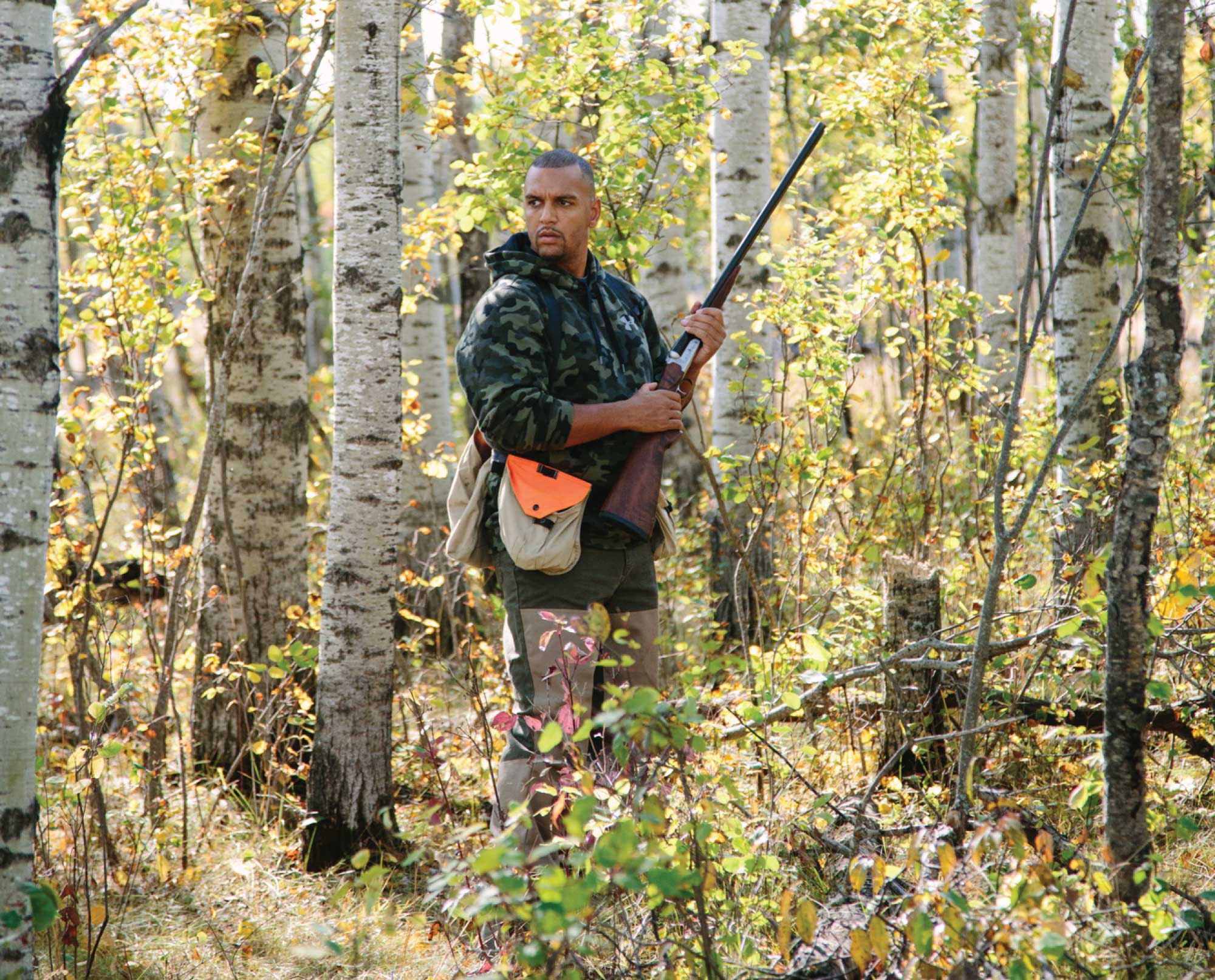 An African American hunter hunting birds.