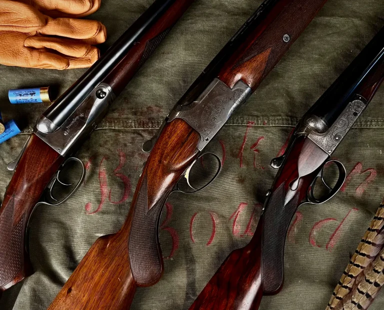 A collection of vintage shotguns used for hunting
