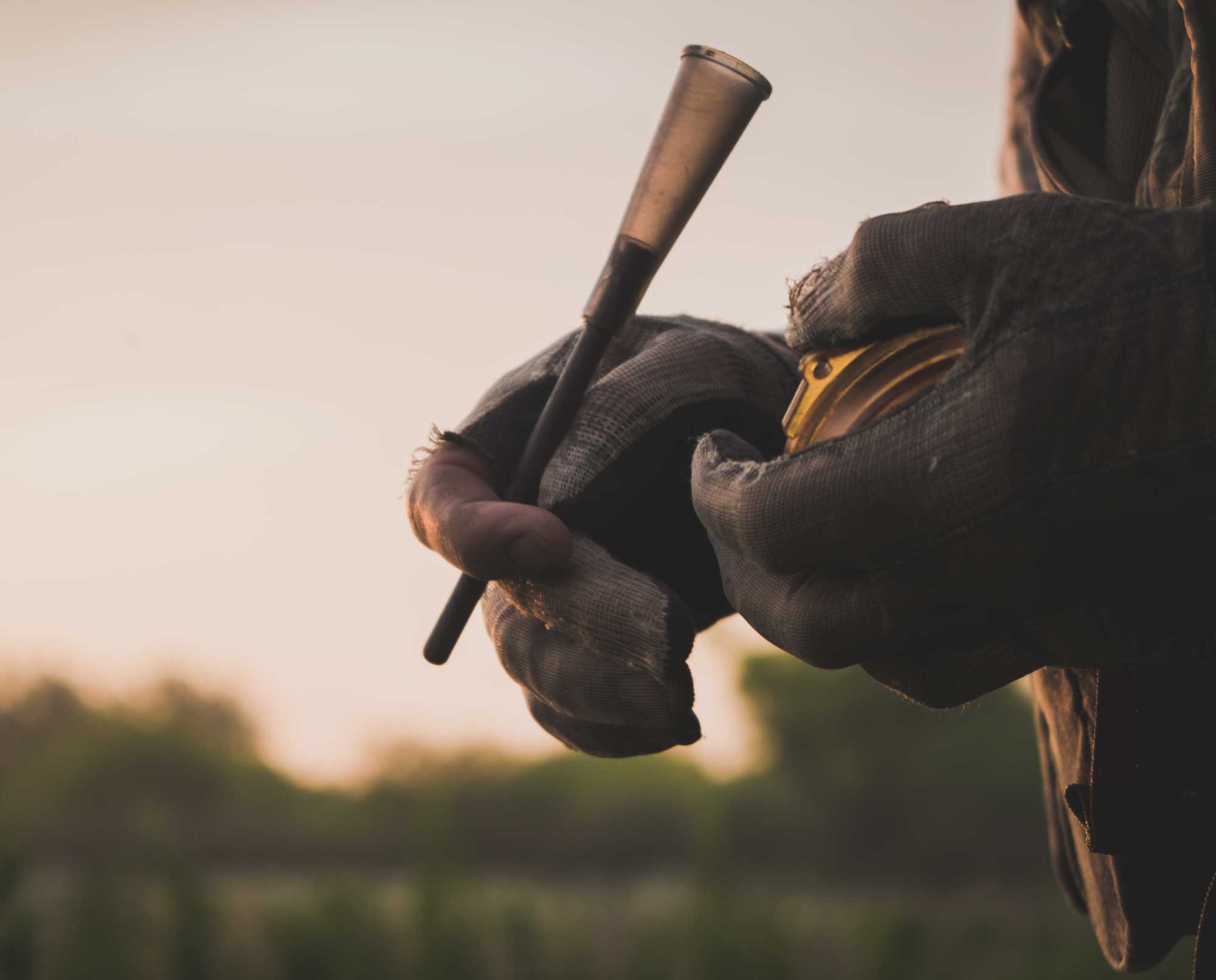 A veteran turkey hunter using a pot call to call in wild turkeys.