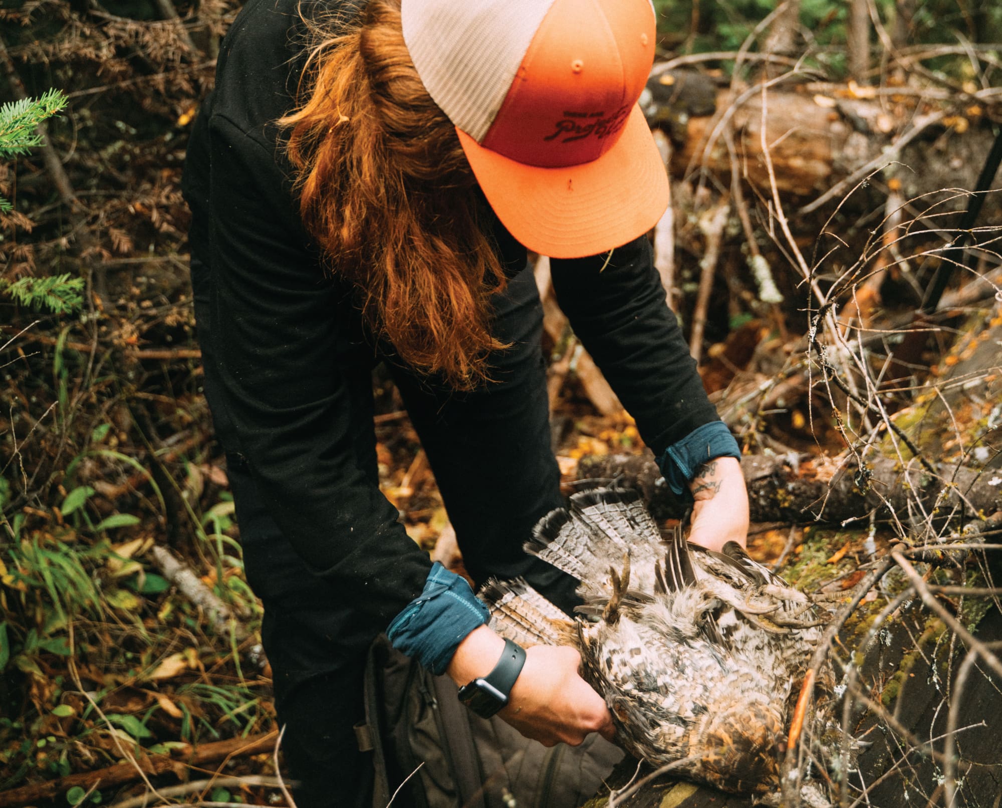 A novice bird hunter celebrates a successful upland hunt.