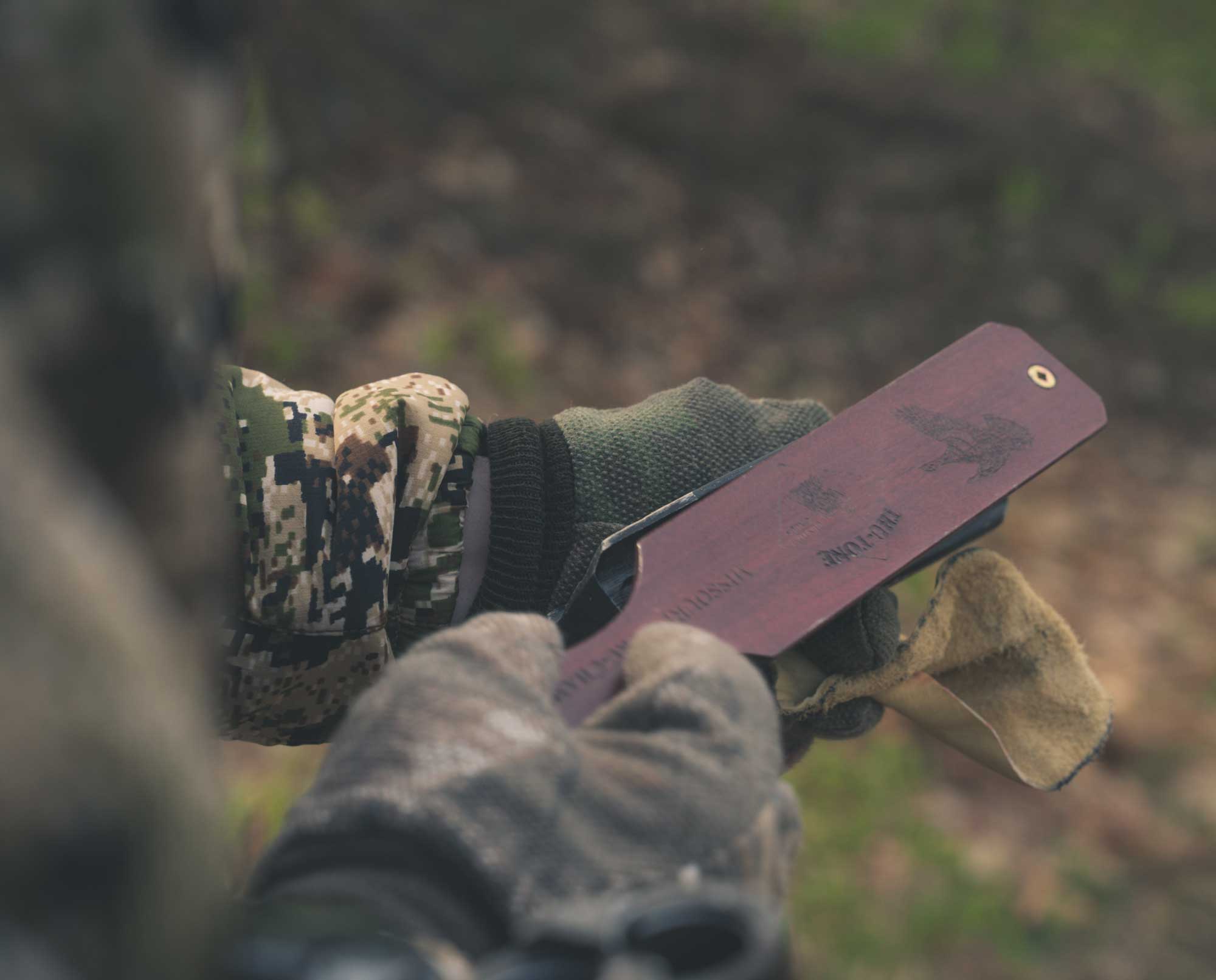 A turkey hunter uses a turkey box call.