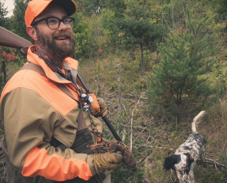 Artist Jay Dowd with an English setter hunting woodcock.