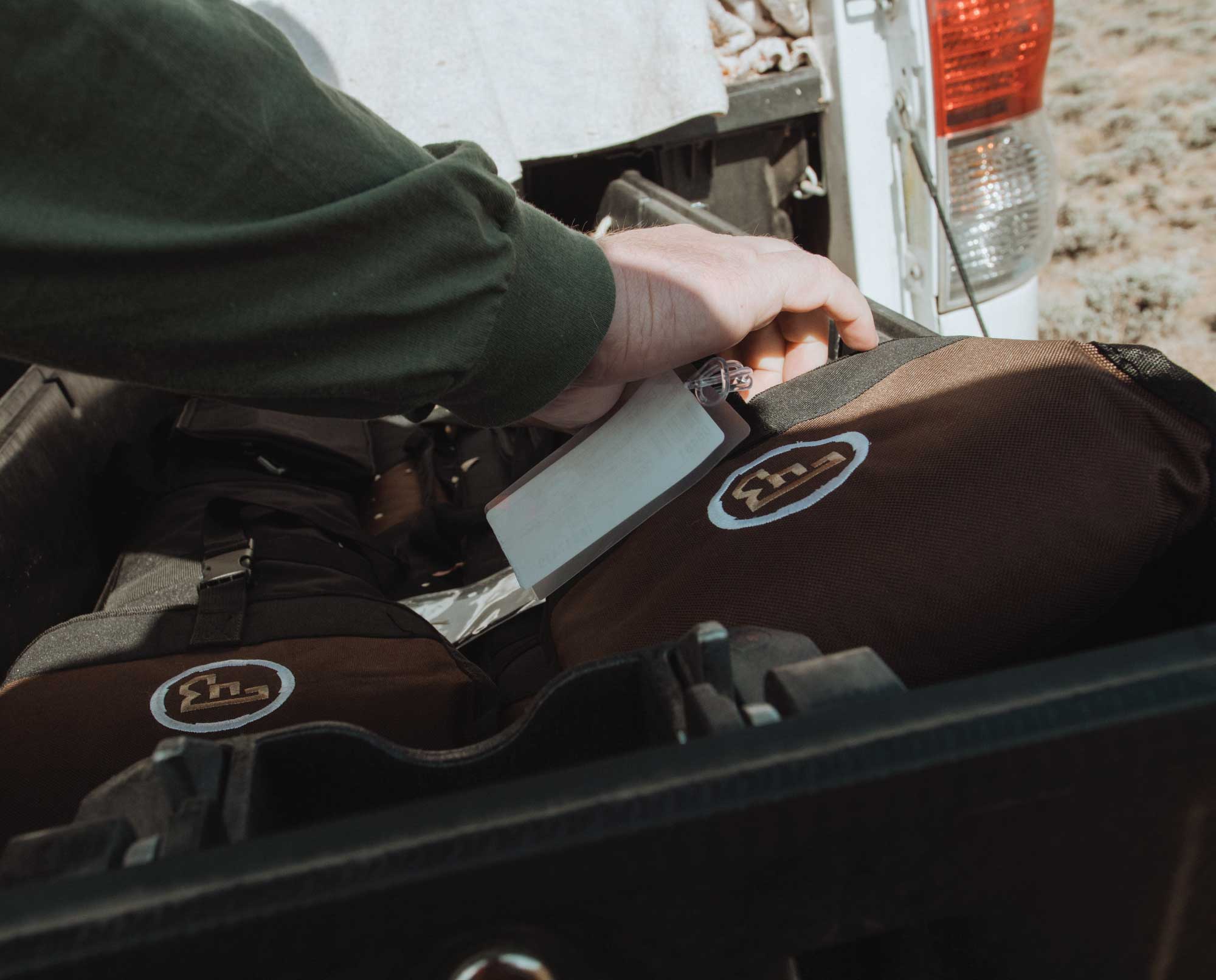 Two CZ-USA over/under shotguns in a truck bed