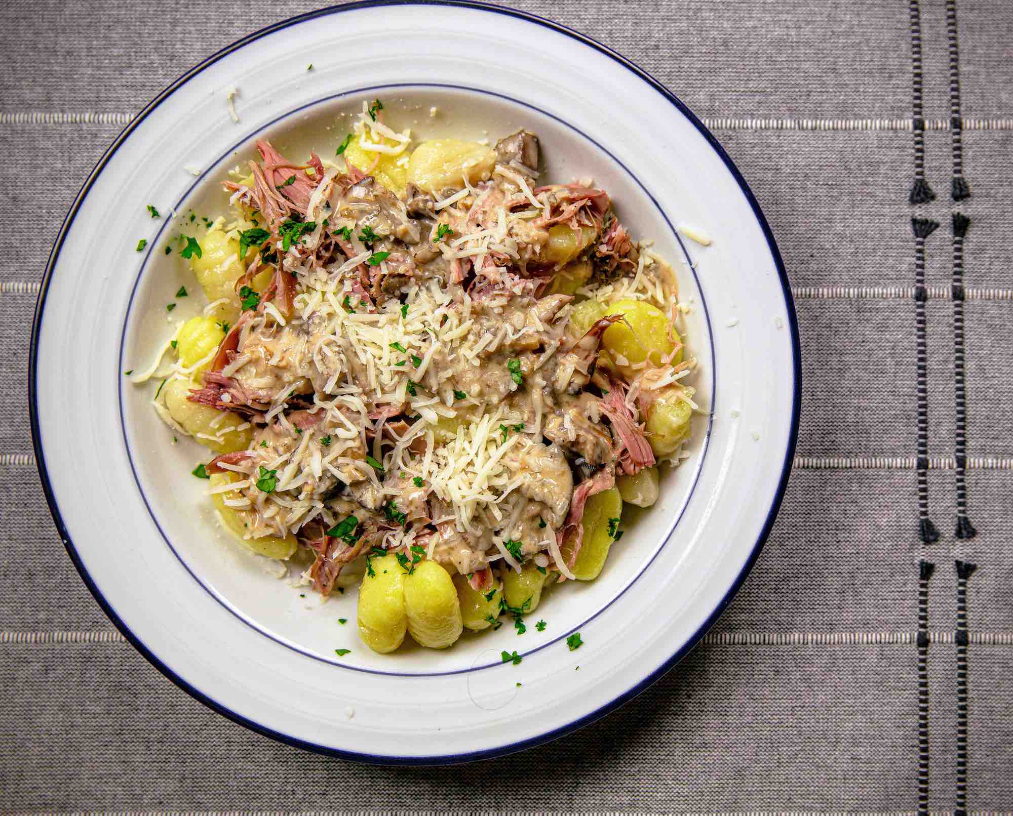 Rabbit gnocchi with mushroom cream sauce