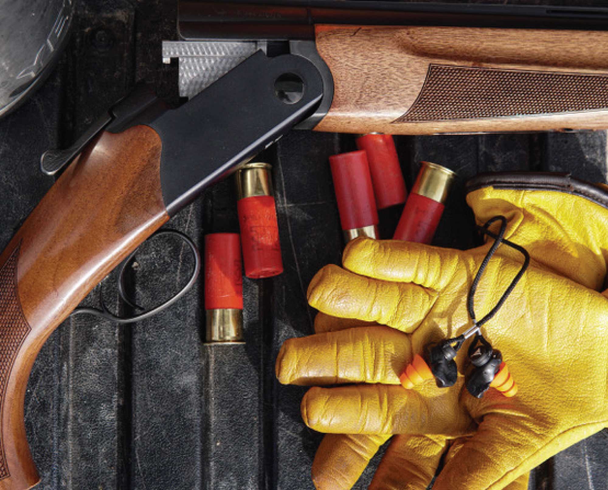 A pair of Decibullz Custom Molded Percussive Shooting Filters on a tailgate after a bird hunt.