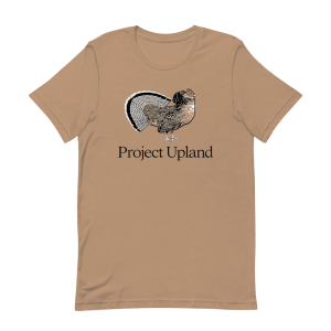 A fanning ruffed grouse on a Project Upland t-shirt in sand dune brown