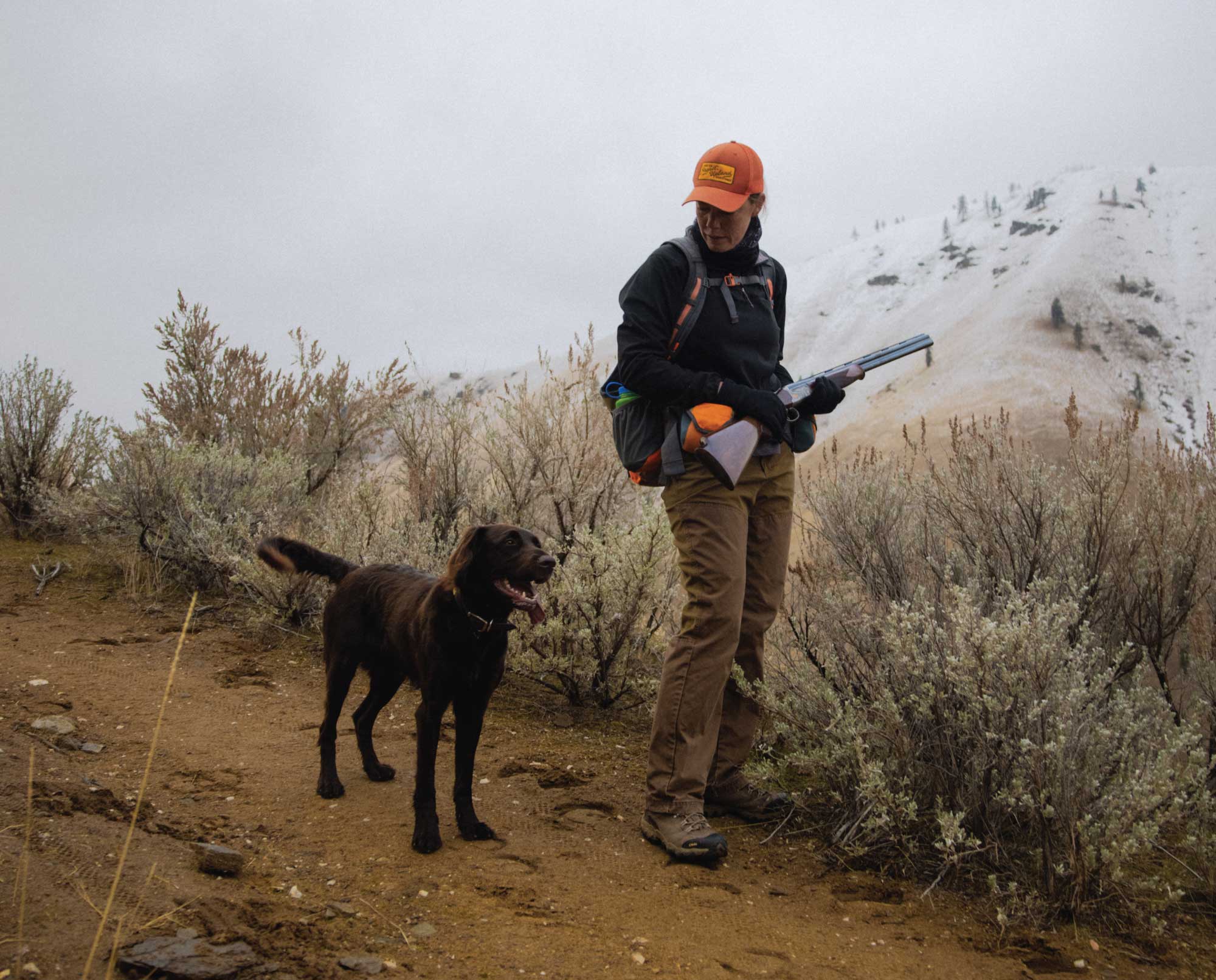A bird hunter and bird dog during it's first hunting season.