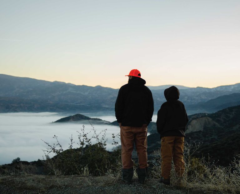A father and son overlook public lands in California