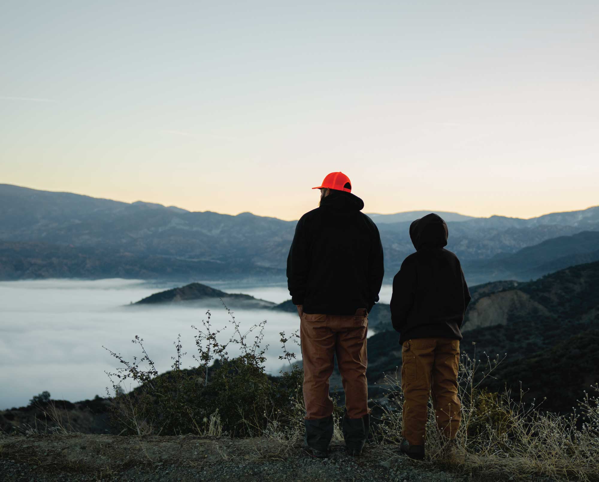 A father and son overlook public lands in California