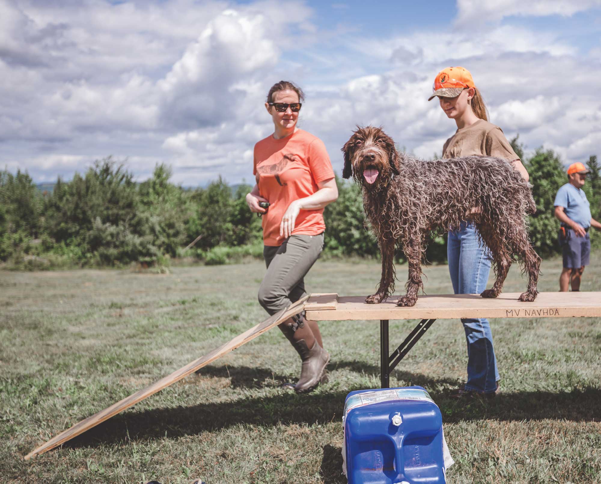 An instructor teaching a teenager during the NAVHDA Youth Program