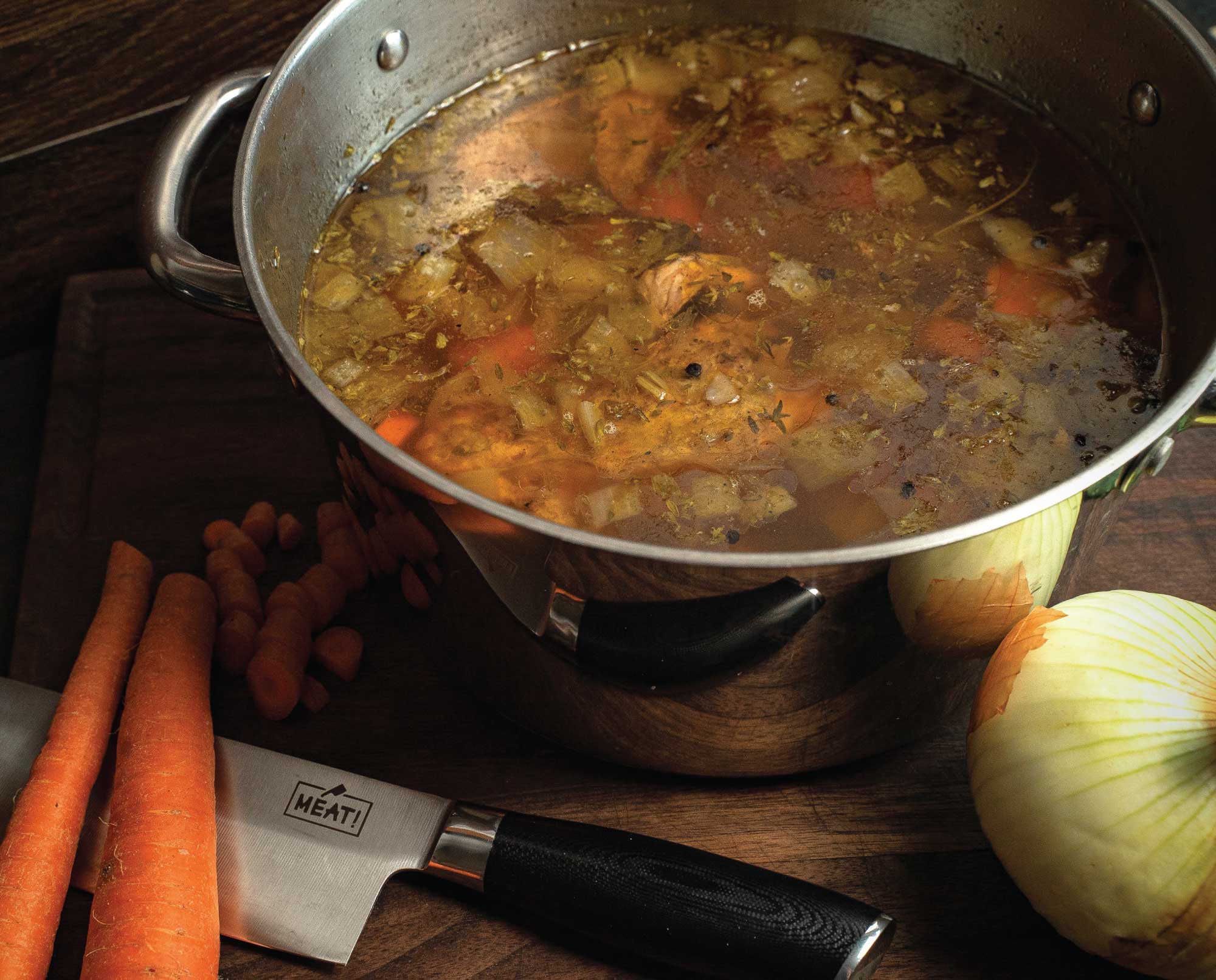 A pot with upland game stock including pheasant and quail