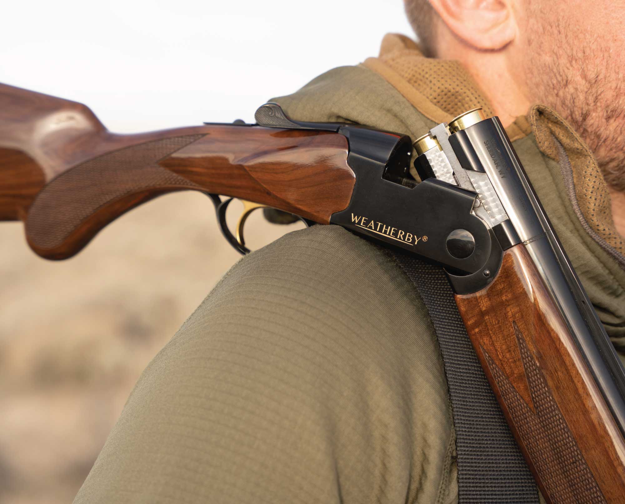 A hunter carries a Weatherby Orion 20 gauge while bird hunting