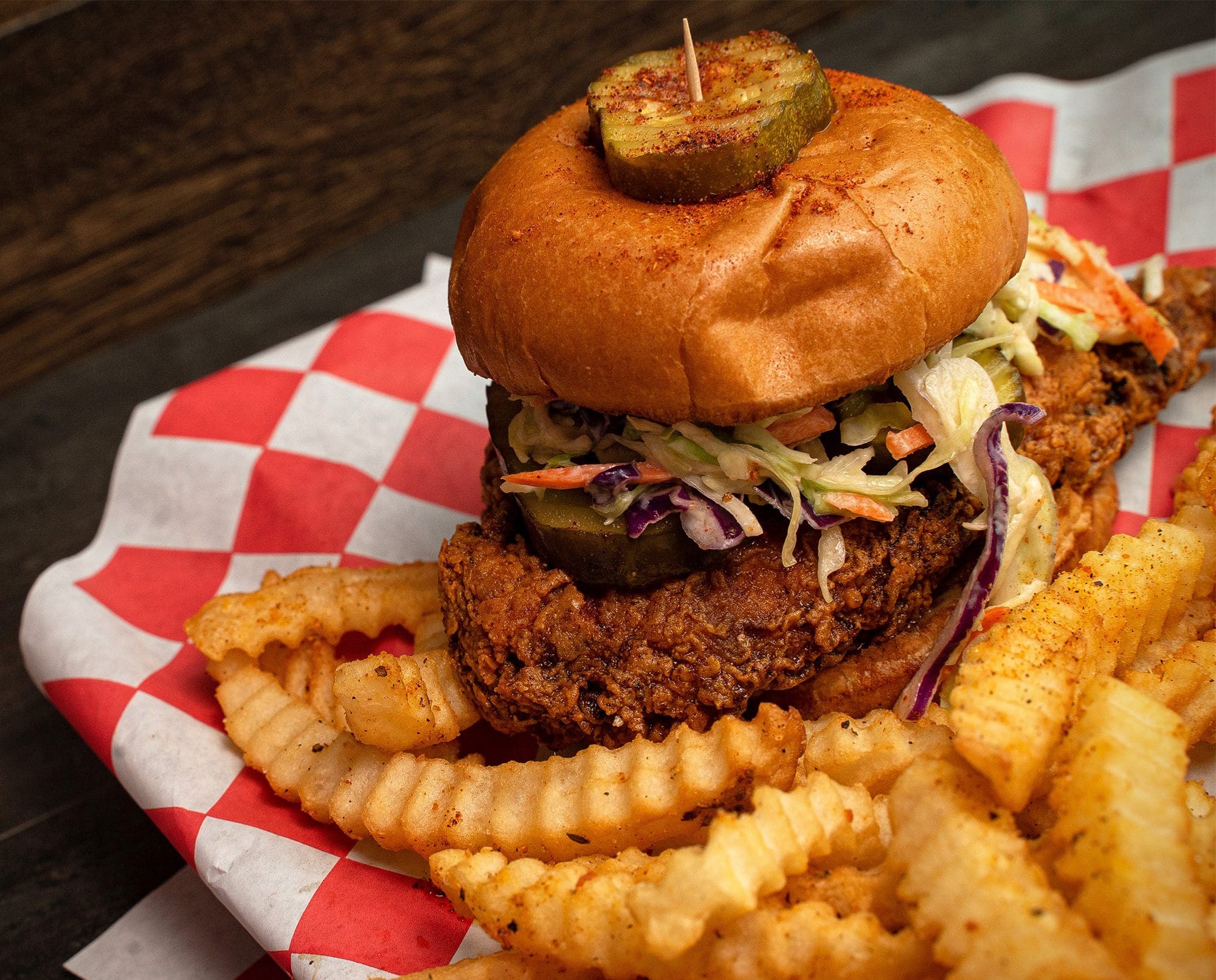 A Nashville hot pheasant sandwich rests on a table.