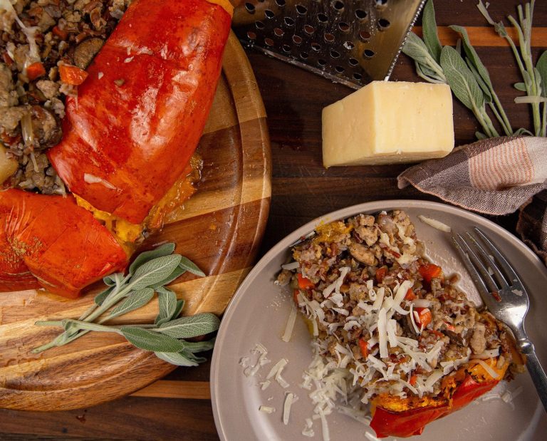 Pheasant stuffed pumpkin sits on a table.