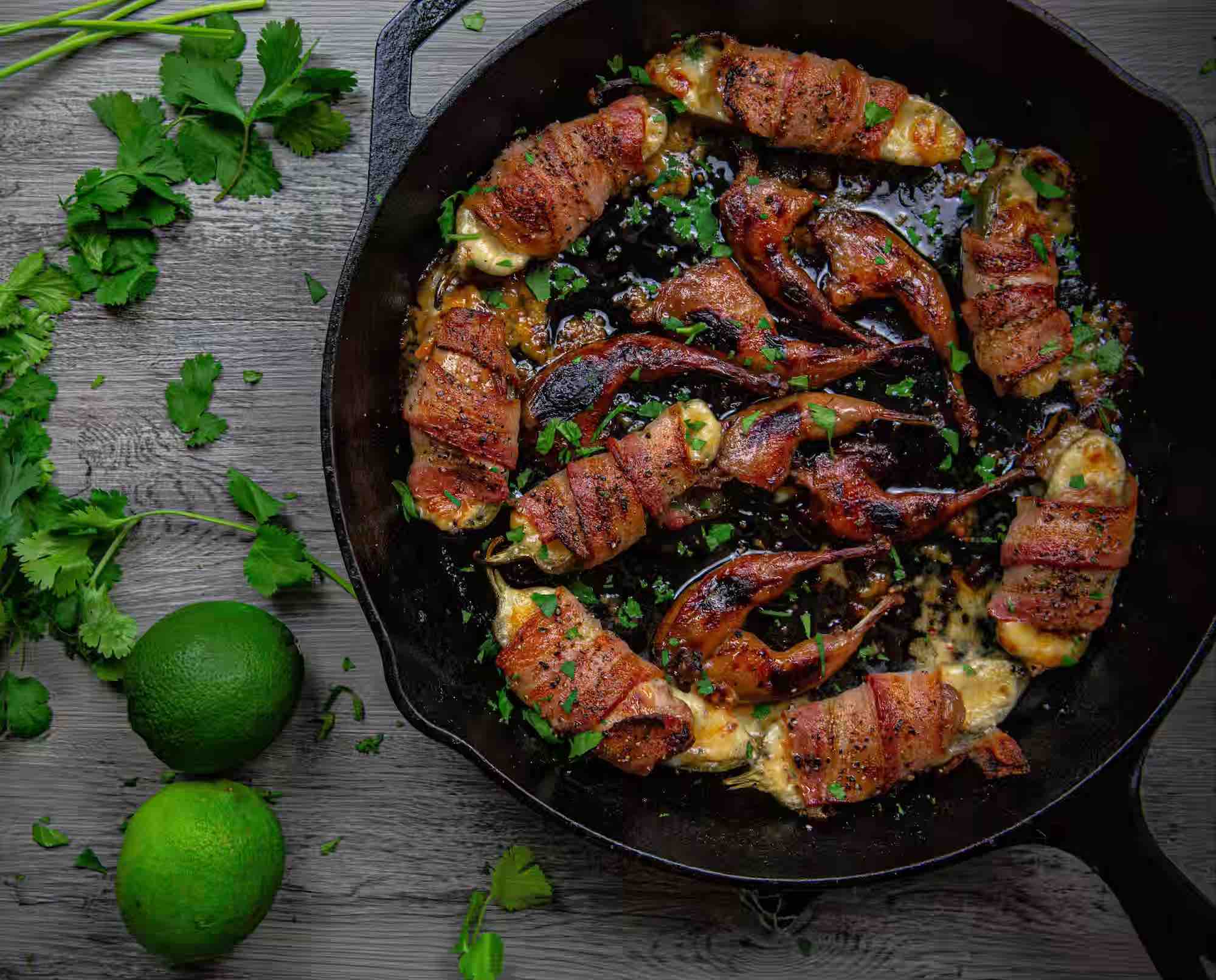 Quail poppers roasted in a cast iron skillet