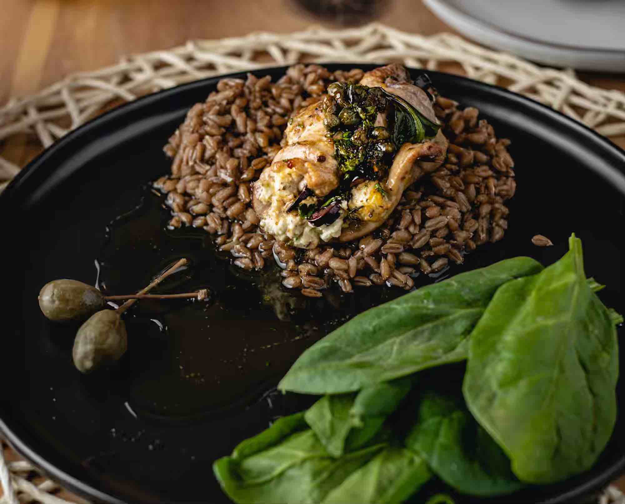Mediterranean Rouladen platted with greens and olives
