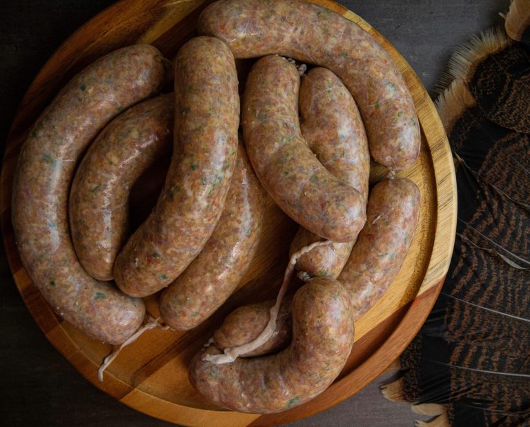 Sausage rests on a plate.