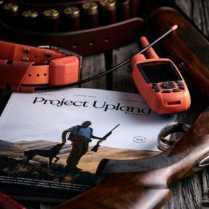Winter 2020 issue of Project Upland Magazine on a table with bird hunting gear